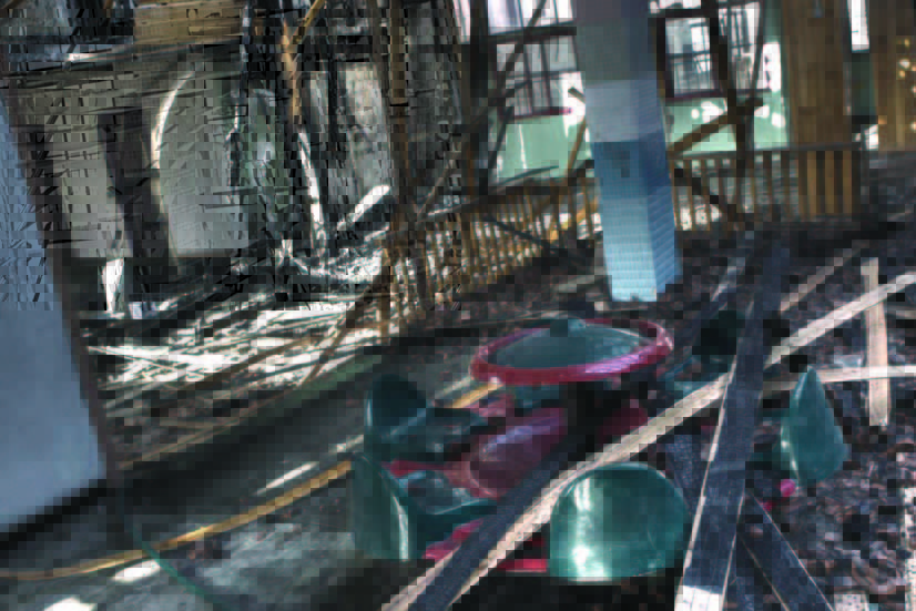 Destruction inside a hospital in Gaza City, with wood and beams falling down everywhere