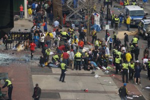 First responders tend to the wounded at the finish line of the Boston Marathon.