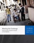 Meeting the Challenge Report Cover: A boy sits ina wheelchair with a friend on both sides.