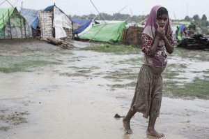 A young Rohingya girl in the rain outside Sittwe, Rakhine State, Myanmar, April 2013.  Photo credit: @PRAD Steve Gumaer.
