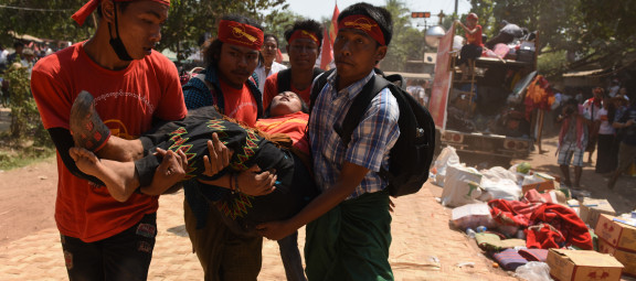 Protesters carry an injured or sick student away after a violent crackdown by police at Letpadan, March 10, 2015. The International Human Rights Clinic and Fortify Rights conducted an investigation that found the police used excessive force against the protesters. The report can be found <a href="http://hrp.law.harvard.edu/press-releases/clinic-and-fortify-rights-hold-police-accountable-for-crackdown-in-myanmar-free-wrongfully-imprisoned-prisoners/">here</a>. ©2015 Sai Zaw/The Irrawaddy.