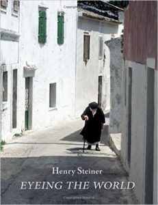 Cover of the book has a picture of an old person with a cane hobbling up a street in the sunlight. The image looks painted, though it's a photograph.