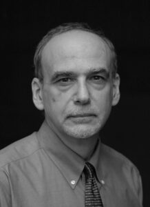 Black and white profile photo of Gerald Neuman