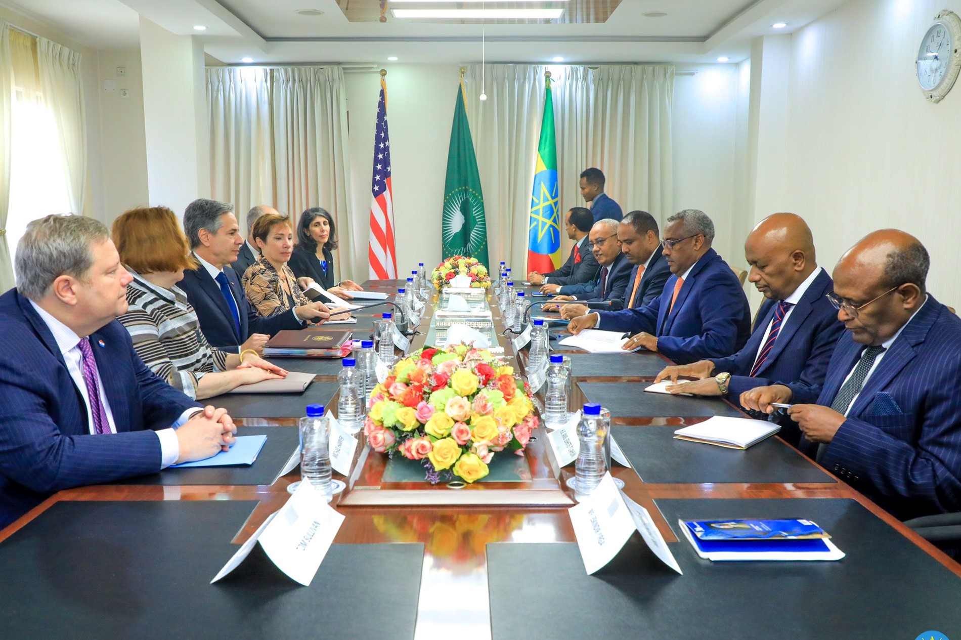 U.S. diplomatic delegation led by Secretary of State Anthony Blinken meeting with representatives of Ethiopian government sitting around table.